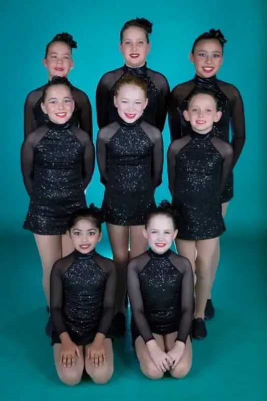 A Group Of Young Girls In Black Dresses Are Posing For A Picture — International Dance Affair In North Mackay, QLD