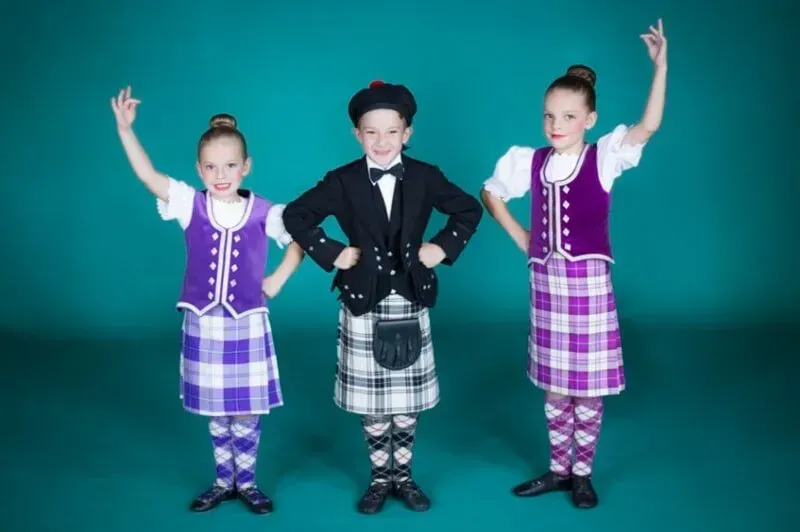A Boy And Two Girls In Kilts Are Standing Next To Each Other — International Dance Affair In North Mackay, QLD