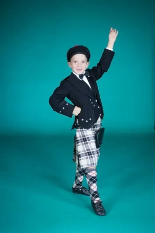 A Young Boy In A Kilt Is Dancing On A Blue Background — International Dance Affair In North Mackay, QLD