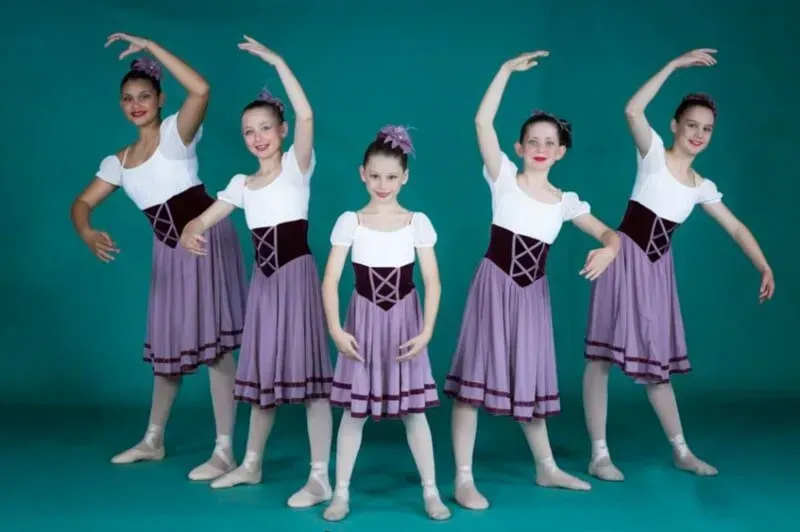 A Group Of Young Girls In Purple And White Dresses Are Posing For A Picture — International Dance Affair In North Mackay, QLD