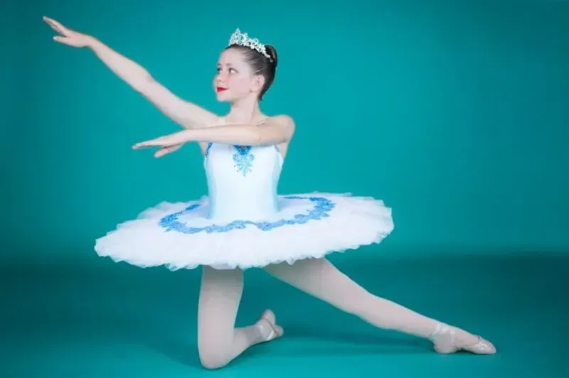 A Woman In White And Blue Tutu Is Dancing — International Dance Affair In North Mackay, QLD