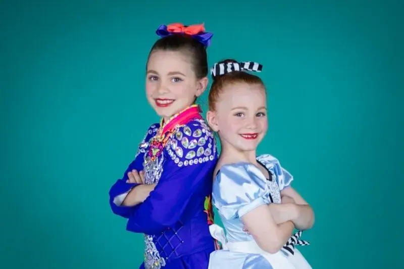 Two Little Girls Are Standing Back To Back With Their Arms Crossed — International Dance Affair In North Mackay, QLD