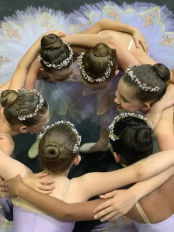 A Group Of Young Girls Are Huddled Together In A Circle — International Dance Affair In North Mackay, QLD