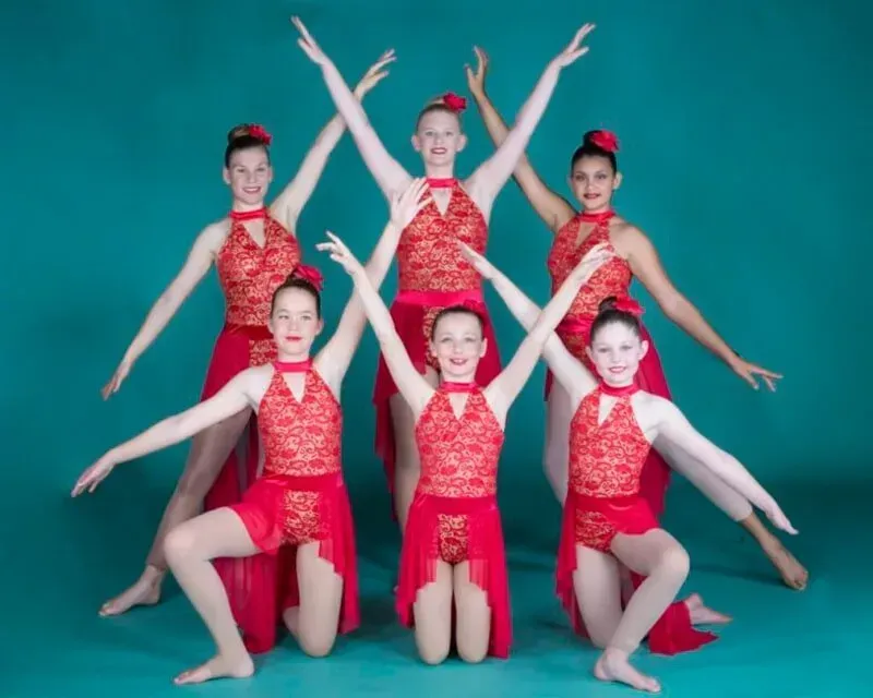 A Group Of Women In Red Dress Is Posing For A Picture — International Dance Affair In North Mackay, QLD