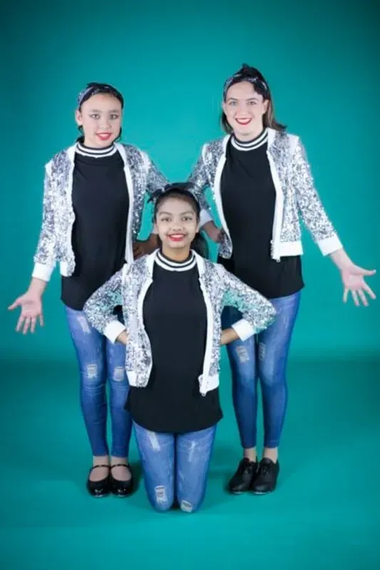 Three Young Girls Are Posing For A Picture On A Blue Background — International Dance Affair In North Mackay, QLD