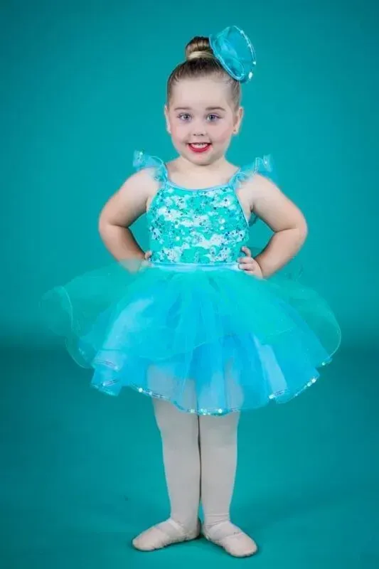 A Young Girl Is Posing For A Picture — International Dance Affair In North Mackay, QLD