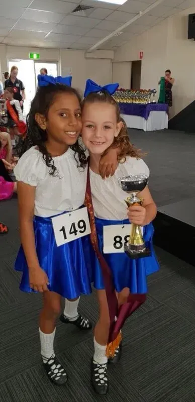 Two Little Girls Are Posing For A Picture And One Has A Trophy In Her Hand — International Dance Affair In North Mackay, QLD