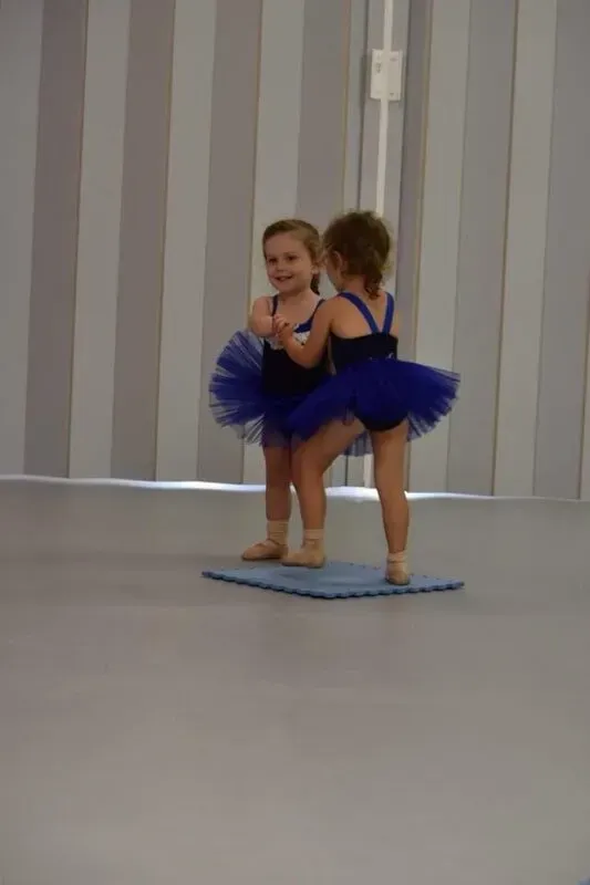 Two Little Girls In Blue Tutus Are Standing Next To Each Other — International Dance Affair In North Mackay, QLD