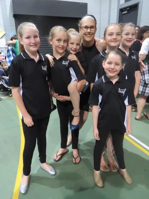 A Group Of Young Girls Are Posing For A Picture With Their Coach — International Dance Affair In North Mackay, QLD
