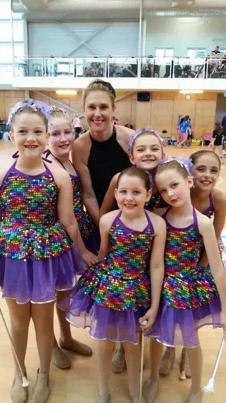 A Group Of Young Girls Are Posing For A Picture With Their Teacher — International Dance Affair In North Mackay, QLD