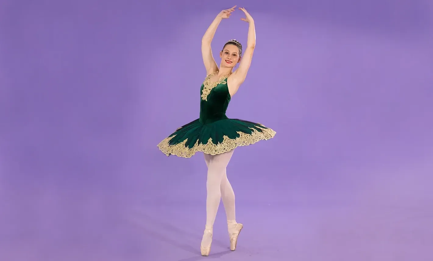 A Ballerina Is Wearing A Green And Gold Tutu And Pointe Shoes — International Dance Affair In North Mackay, QLD