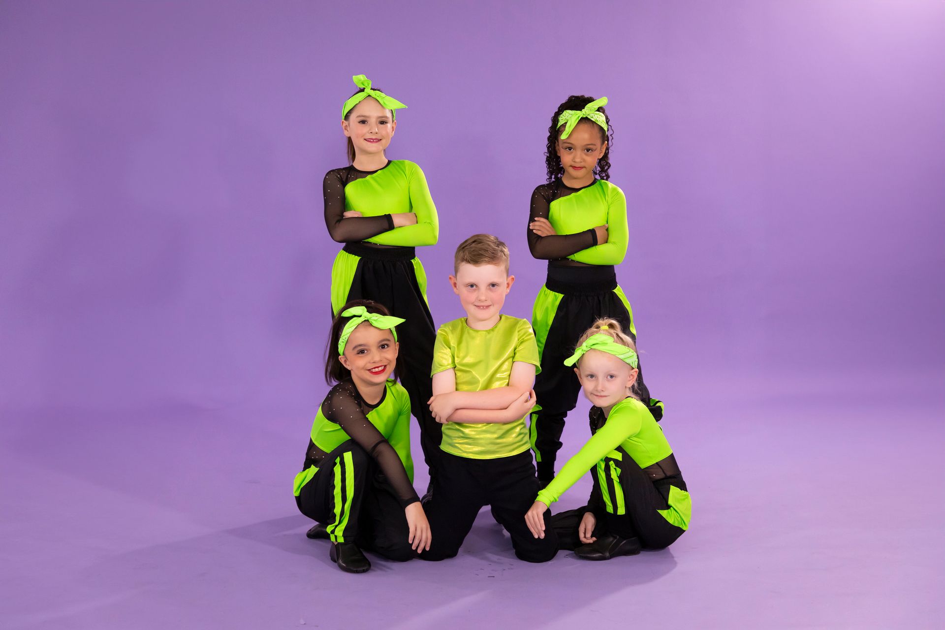 A Group Of Young Dancers Are Posing For A Picture On A Purple Background — International Dance Affair In North Mackay, QLD