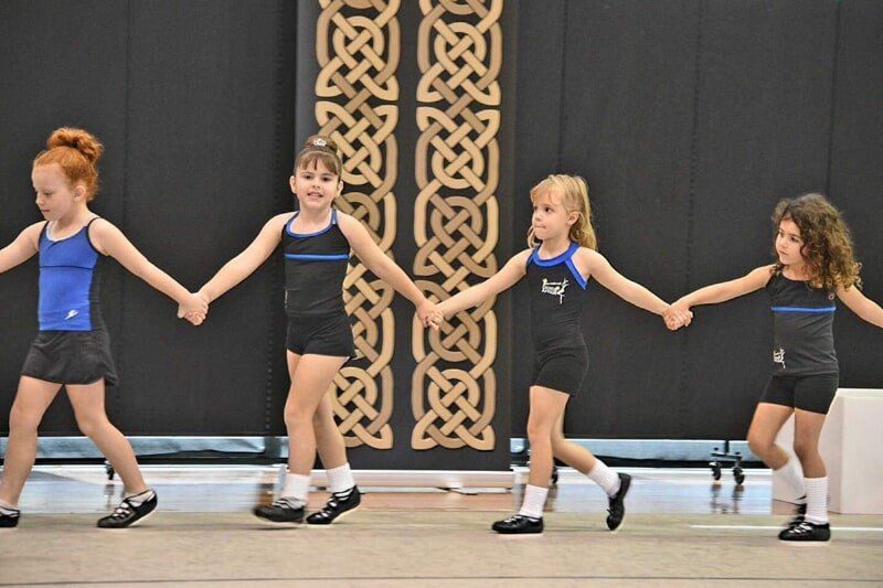 A Group Of Young Girls Are Holding Hands While Dancing — International Dance Affair In North Mackay, QLD
