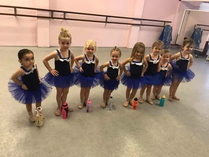 A Group Of Young Girls In Blue Tutus Are Standing Next To Each Other — International Dance Affair In North Mackay, QLD