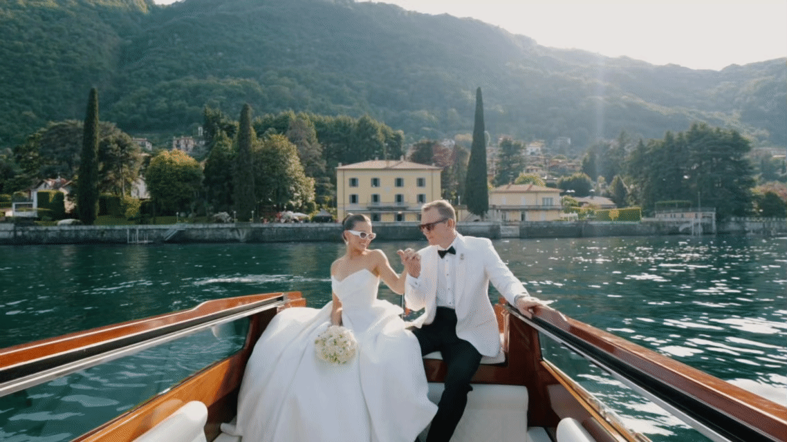 Bride and groom on boat at Lake Como wedding near Villa d’Este romantic destination wedding Italy
