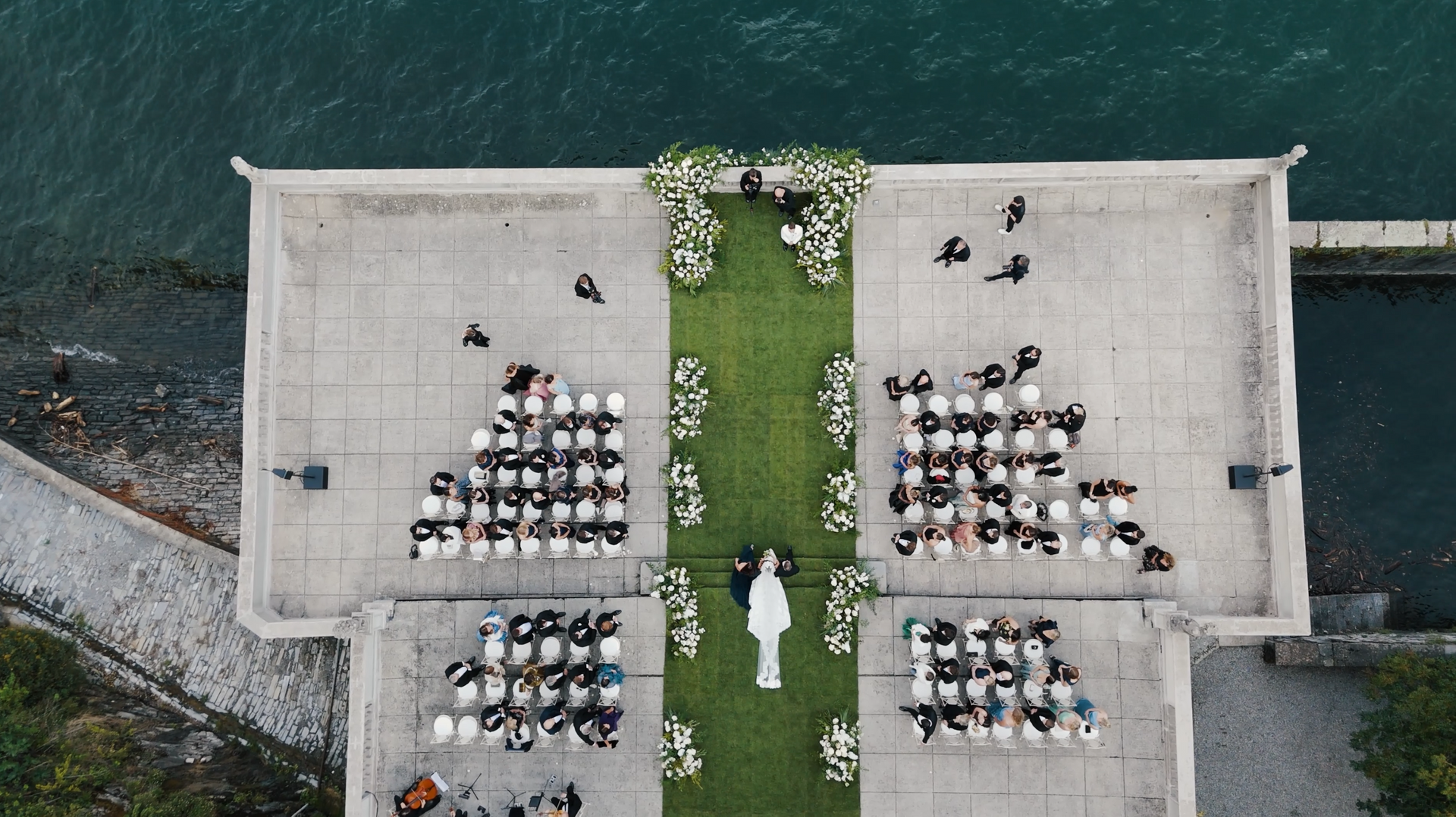 Ceremony set up on the lakefront terrace at Villa Pizzo, Lake Como, in late afternoon light