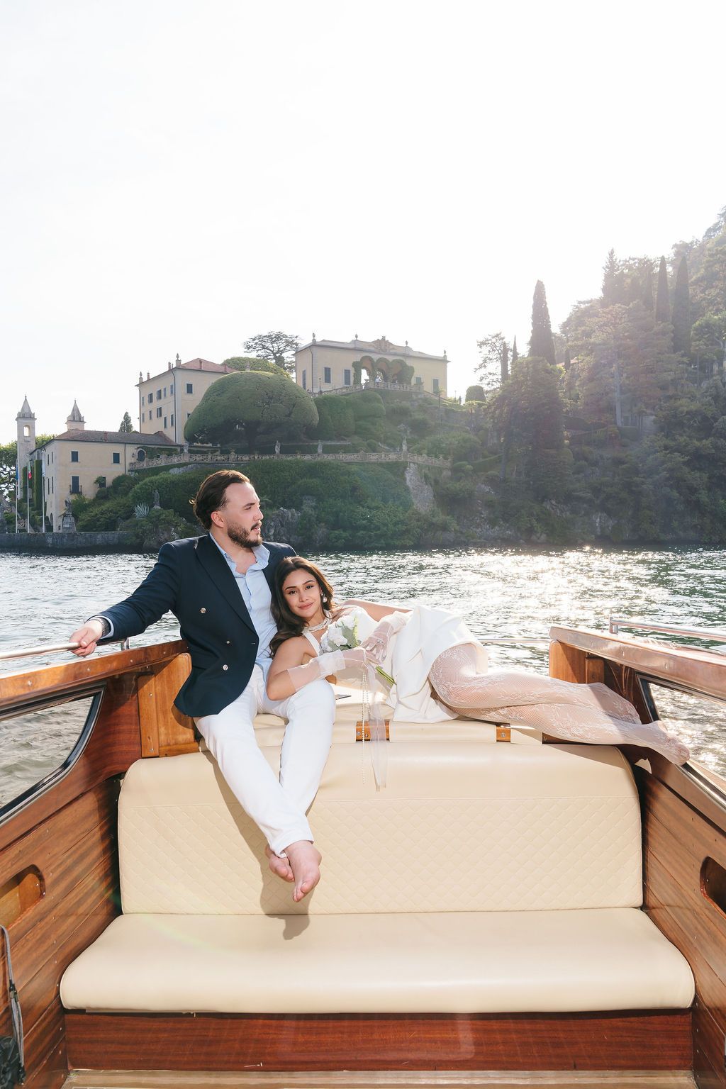 Destination wedding photographer capturing a couple on the shore of Lake Como