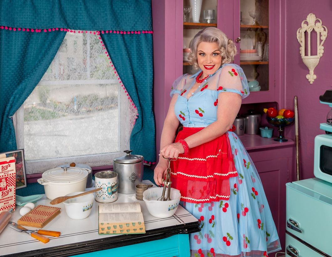 Pin up girl, 1950's inspired, baking/cooking in vintage studio kitchen
