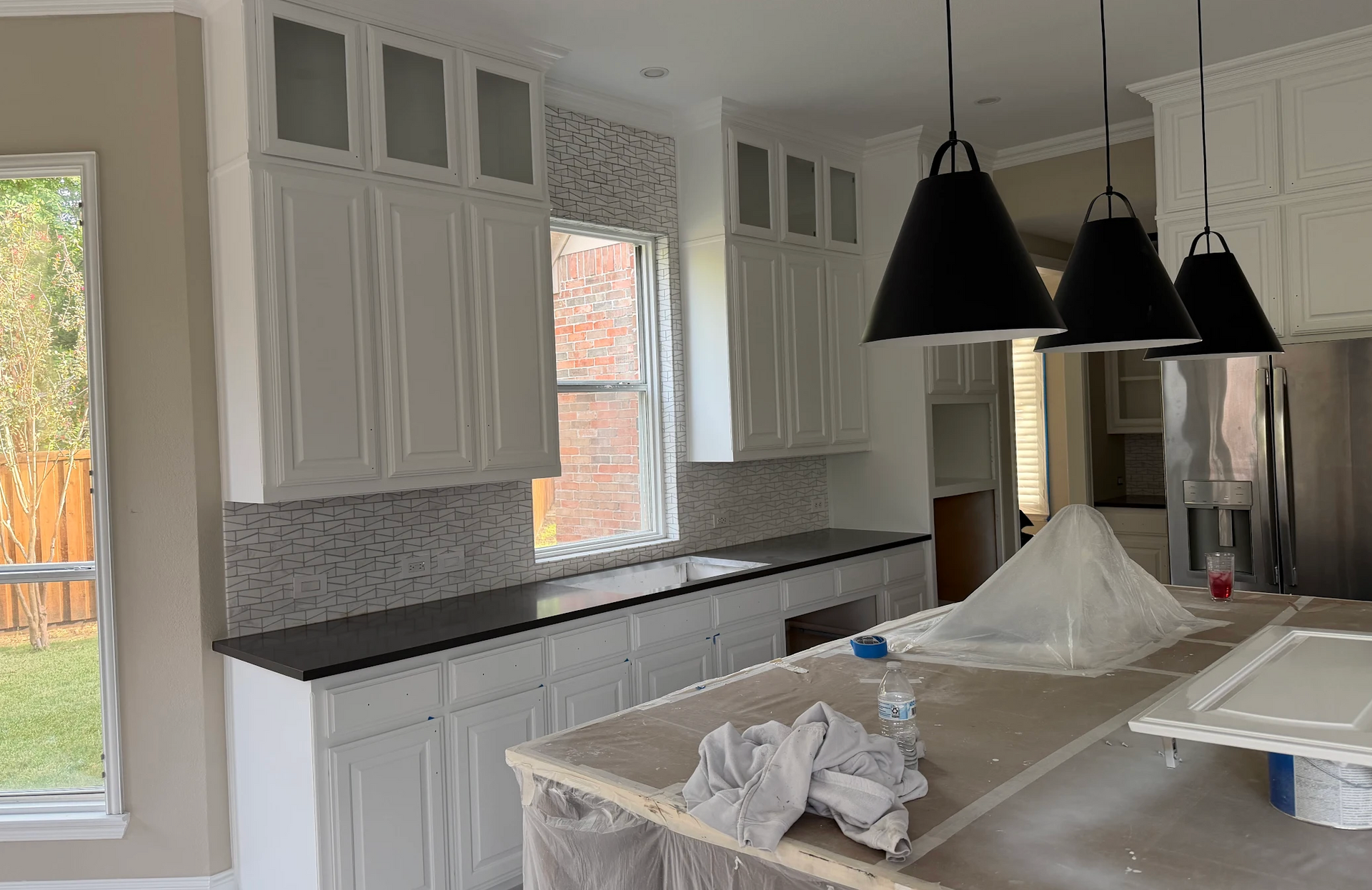 Kitchen cabinet painting project completed by Hutch-N-Son Painting