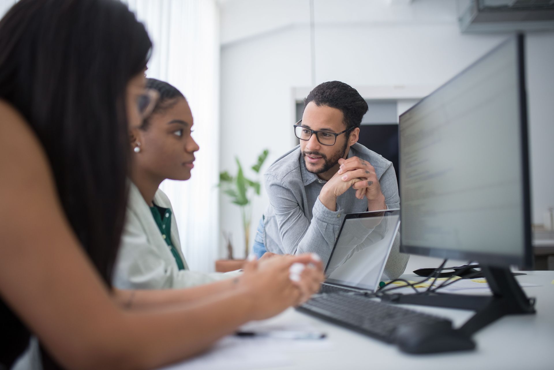 IT team working together at their desk.