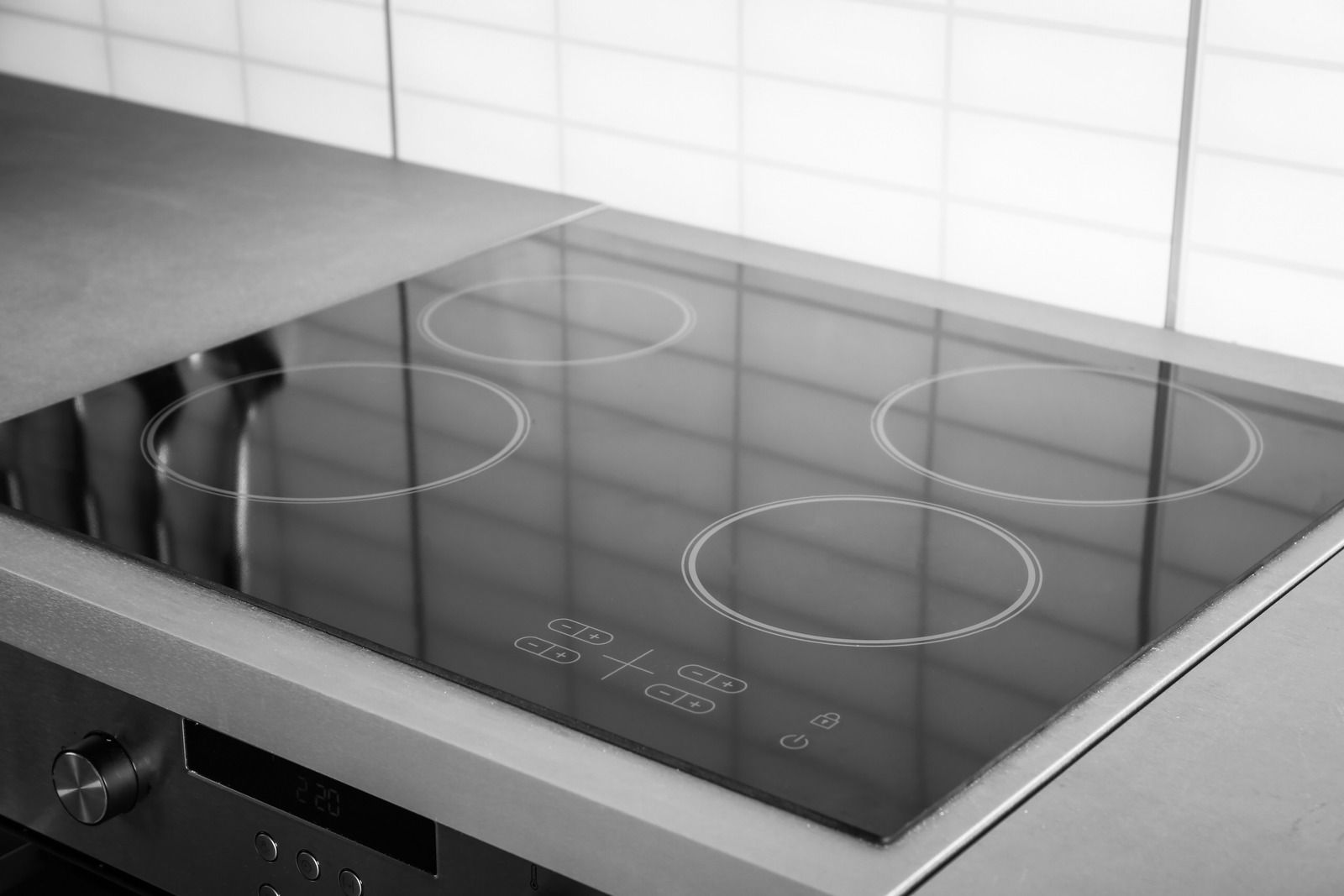 A kitchen with a refrigerator filled with fruits and vegetables.