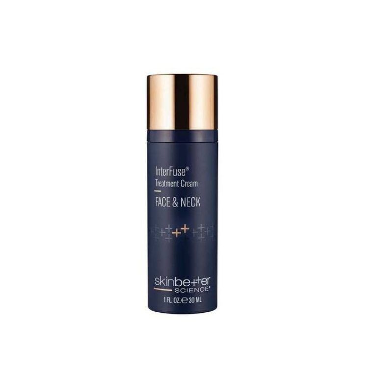 Dark blue skincare bottle with gold cap, labeled