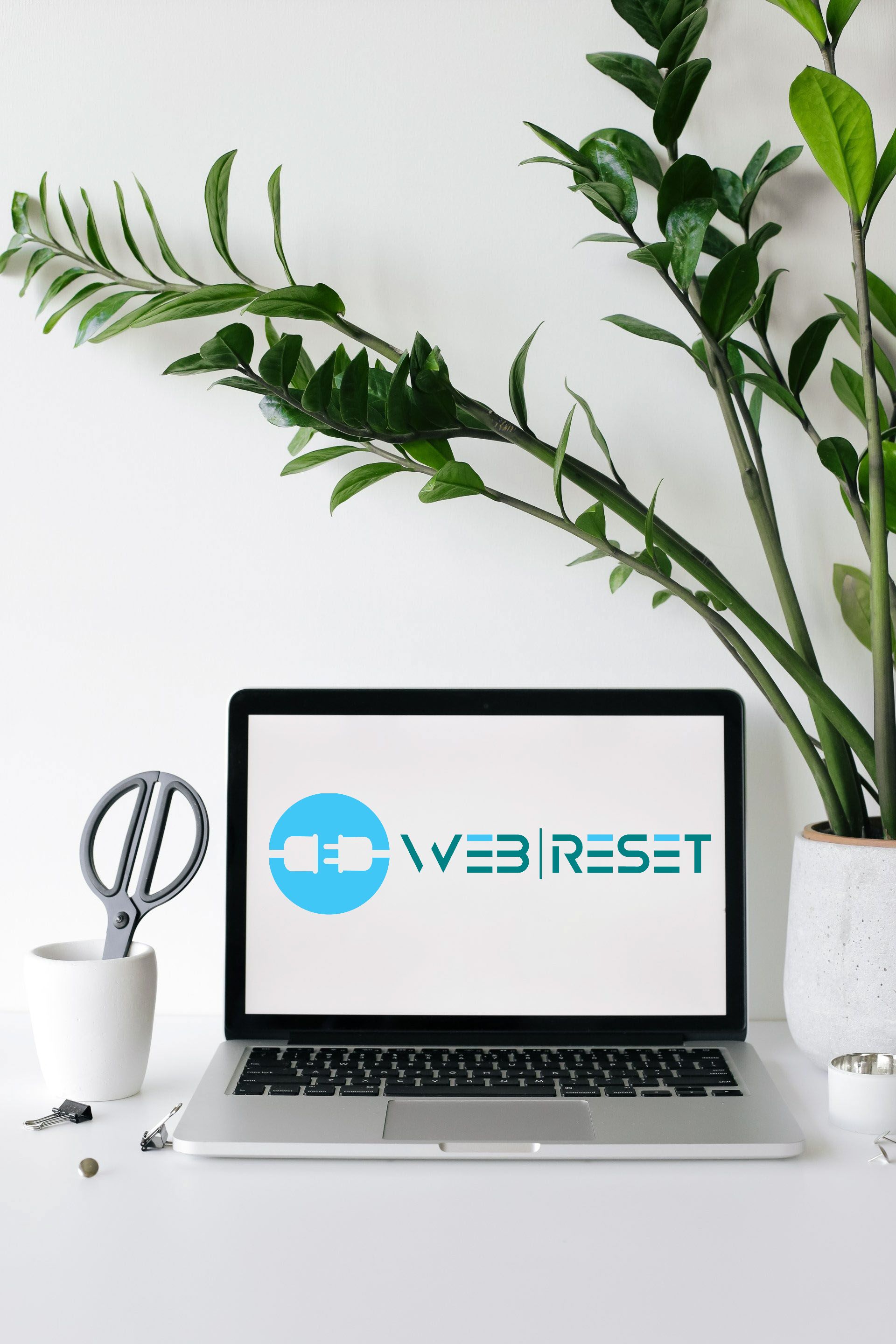 Een laptop met het web reset-logo op het scherm