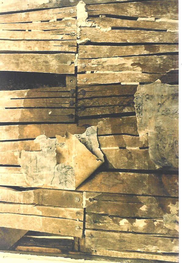 A stack of wooden boards with a few pieces missing