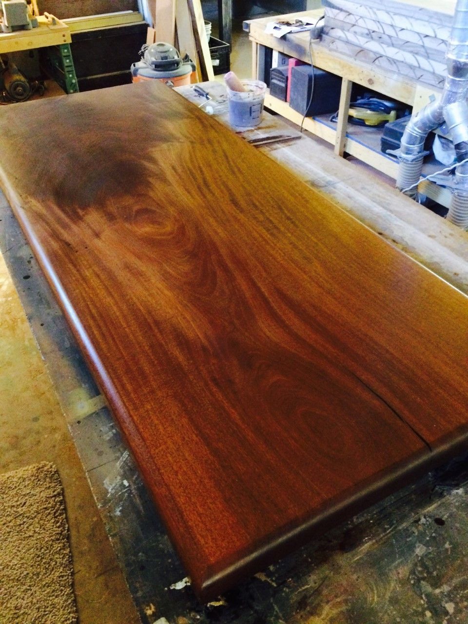 A large piece of wood is sitting on a table