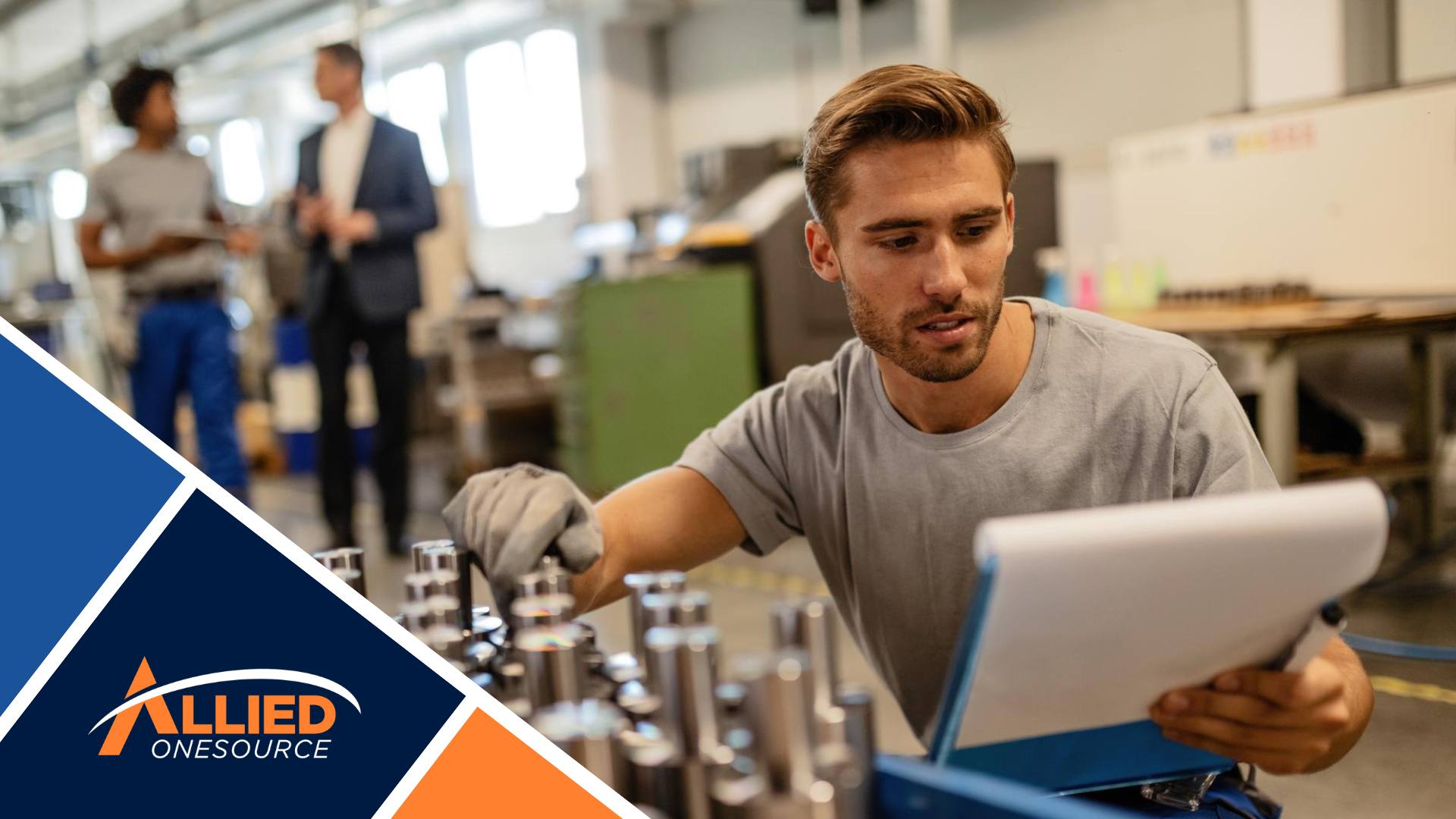 Manufacturing employee reviewing production documentation as part of a Q4 staffing plan.
