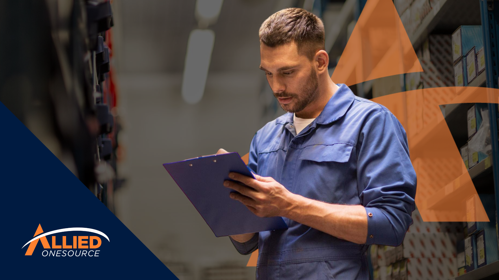 Skilled trades worker in a uniform reviewing a clipboard in a warehouse aisle