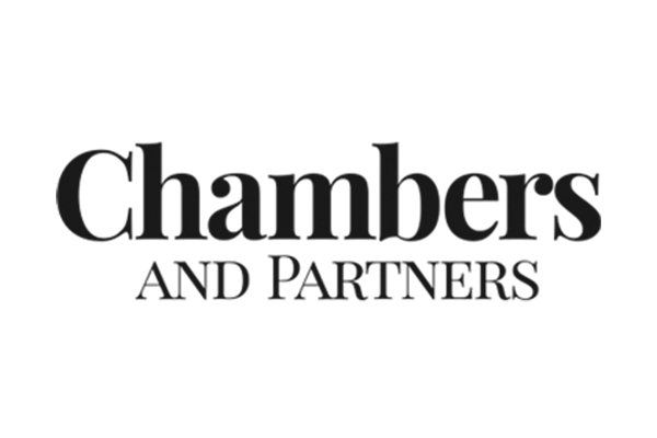 A black and white logo for chambers and partners