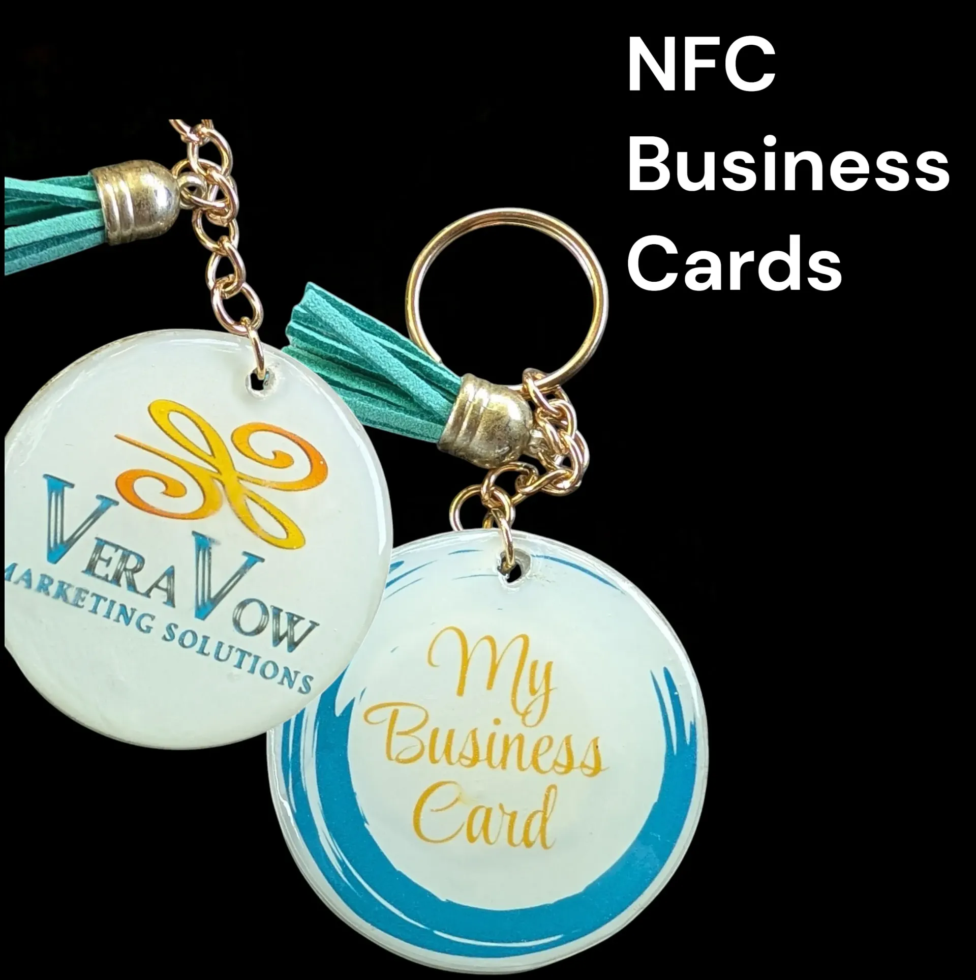Two NFC business card keychains, round and white, with branding and turquoise accents.