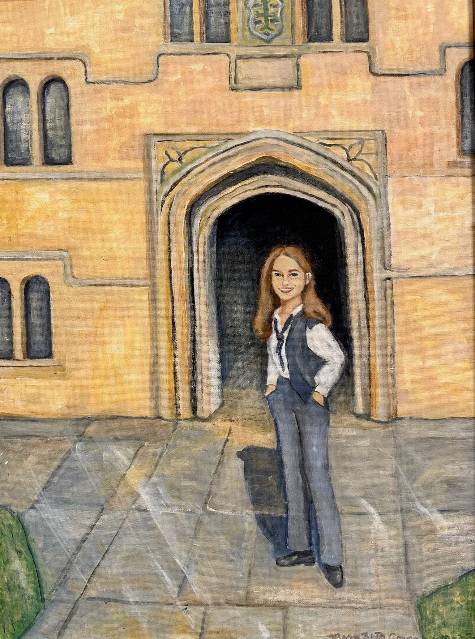Person standing in front of an arched stone doorway on a tan building courtyard