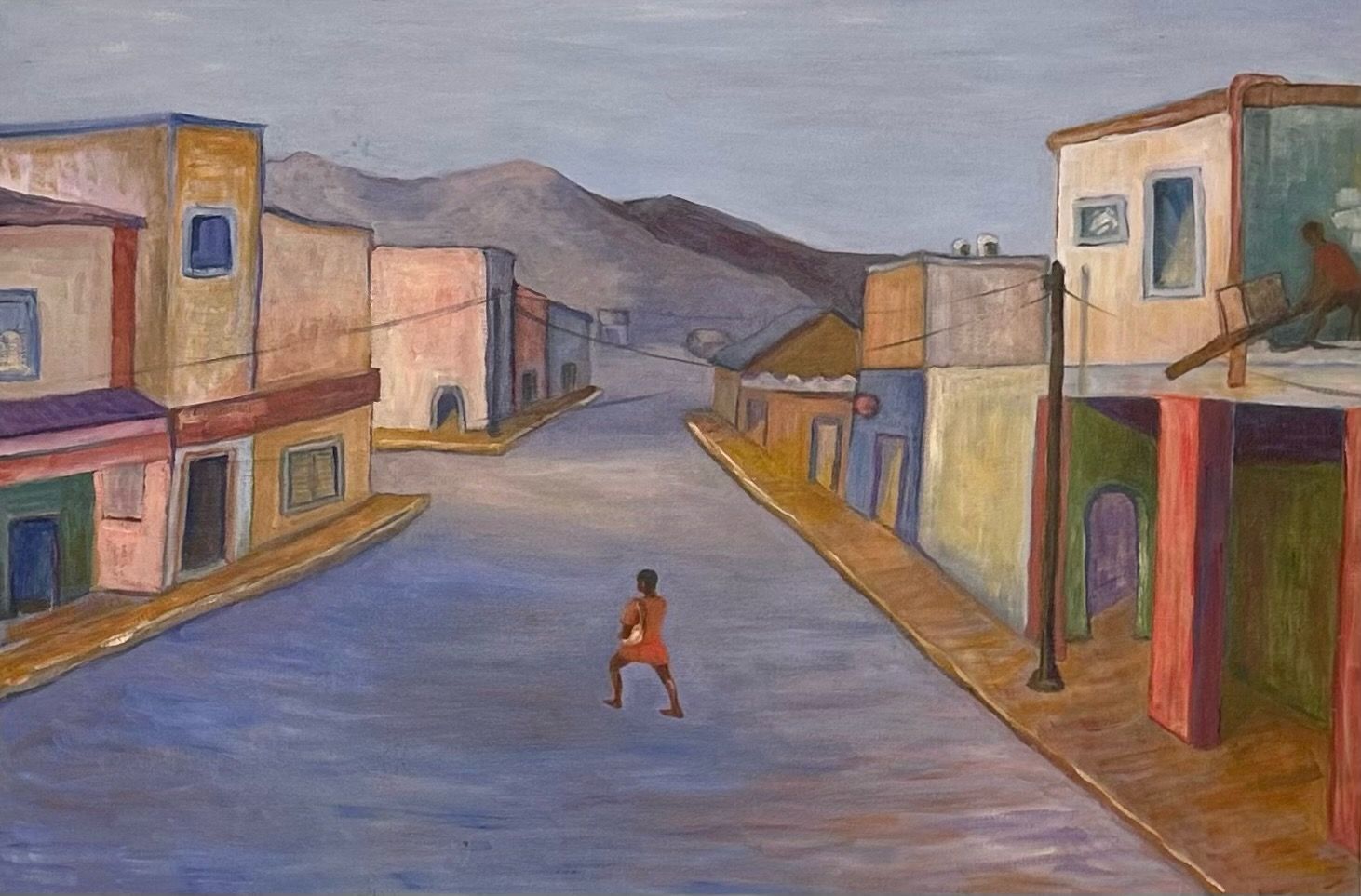 Wide empty street between pastel buildings with a lone person standing in the center under a cloudy sky