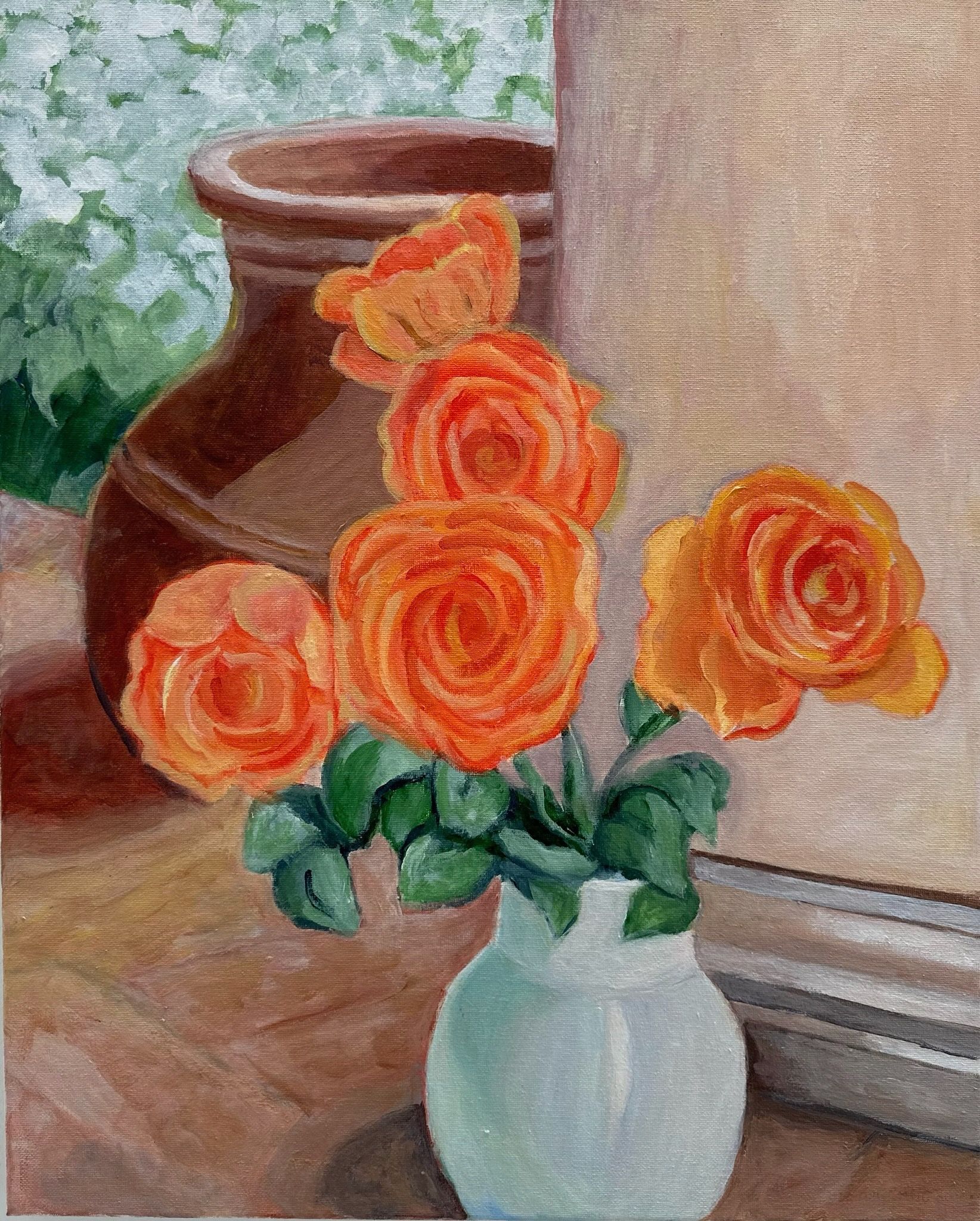 Orange roses in a white vase beside a brown pot near a sunlit window