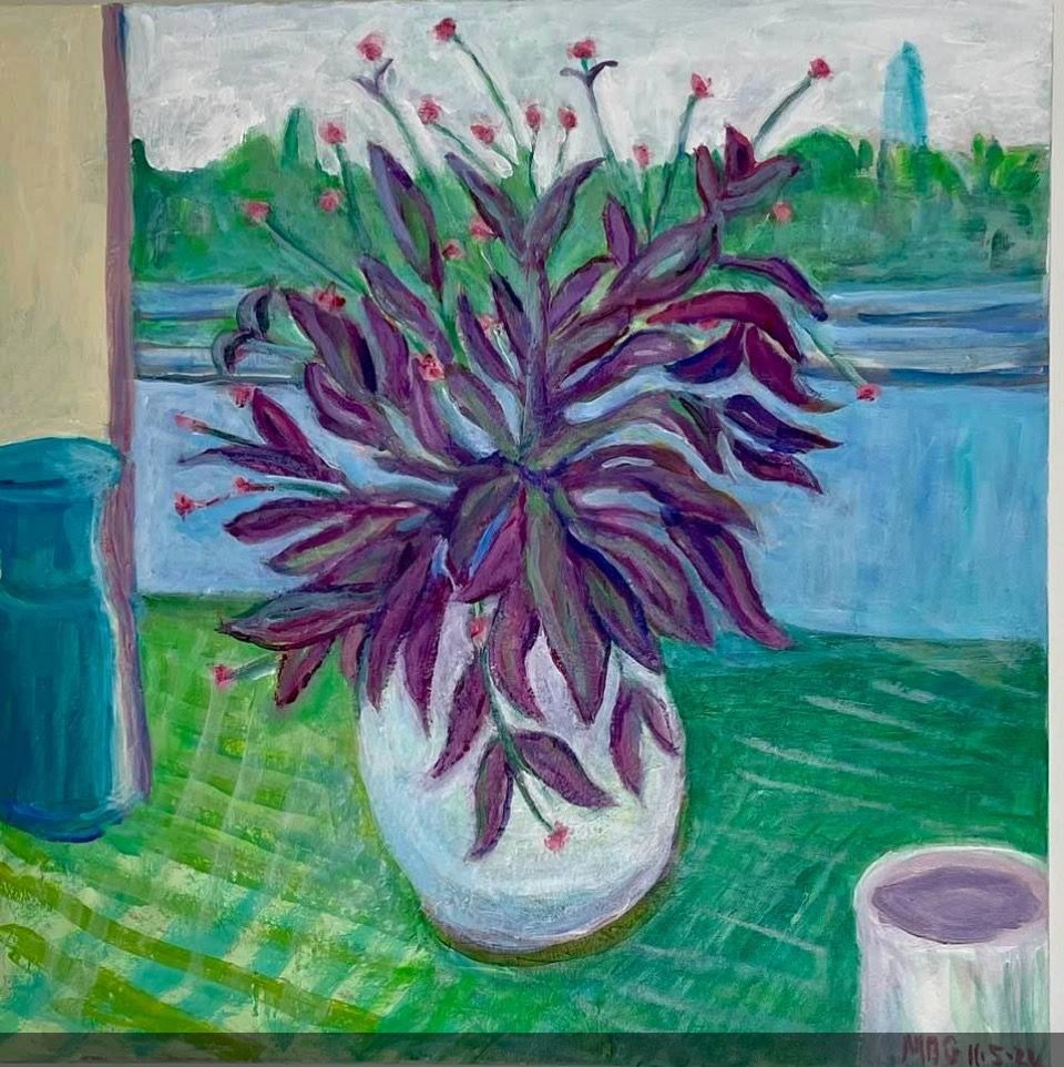 Purple potted plant on a green table by a window, with a blue vase and cup nearby.
