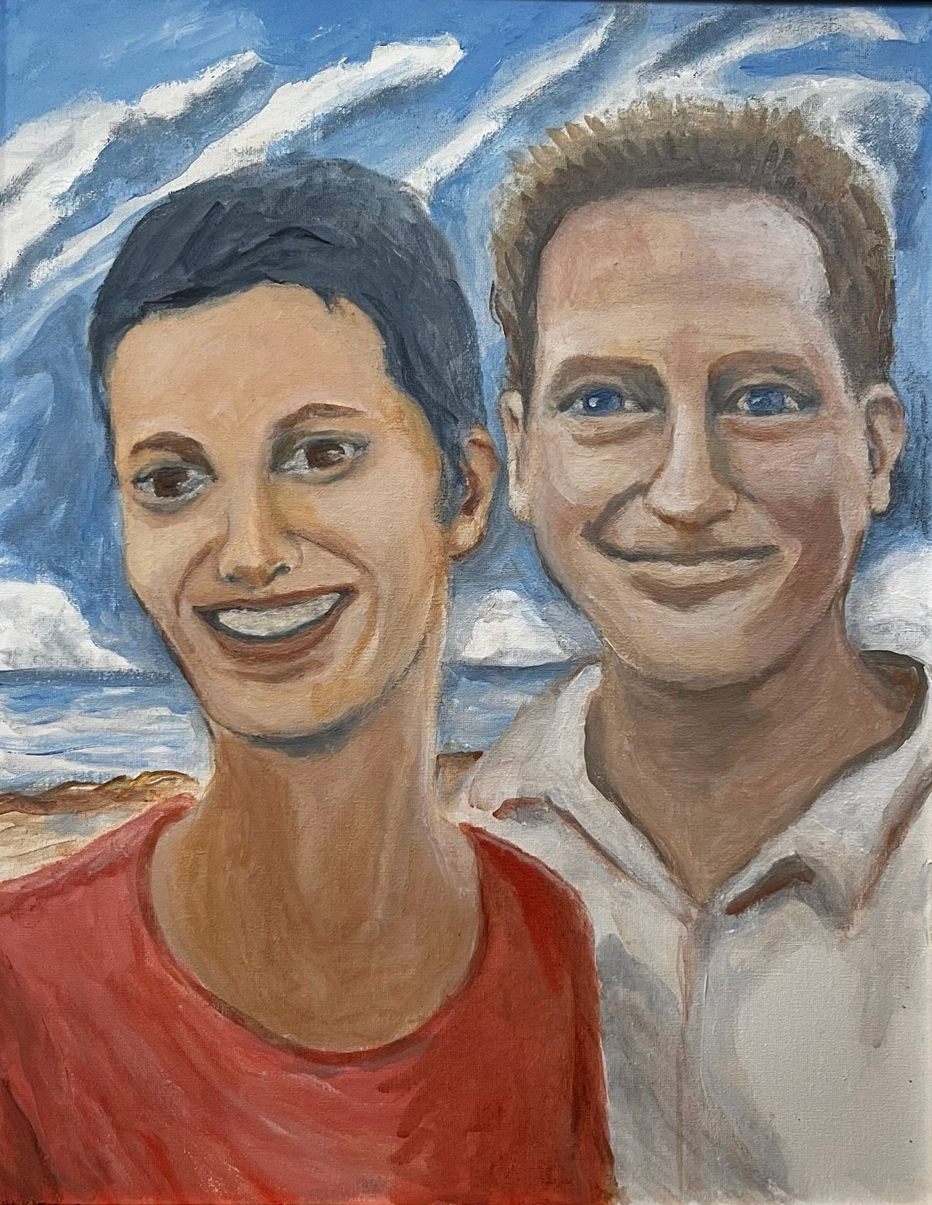 Two smiling people in front of a blue sky with clouds, one in a red shirt and one in a white shirt