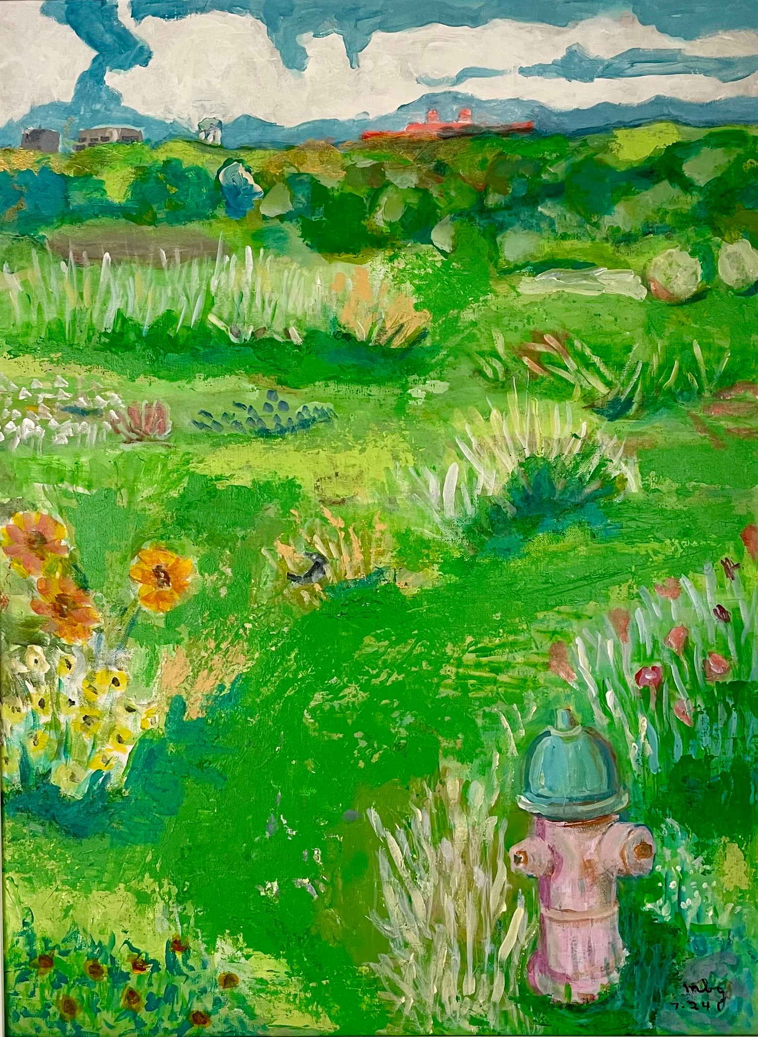 Child in blue hat looking over a bright green flower field under a cloudy sky.
