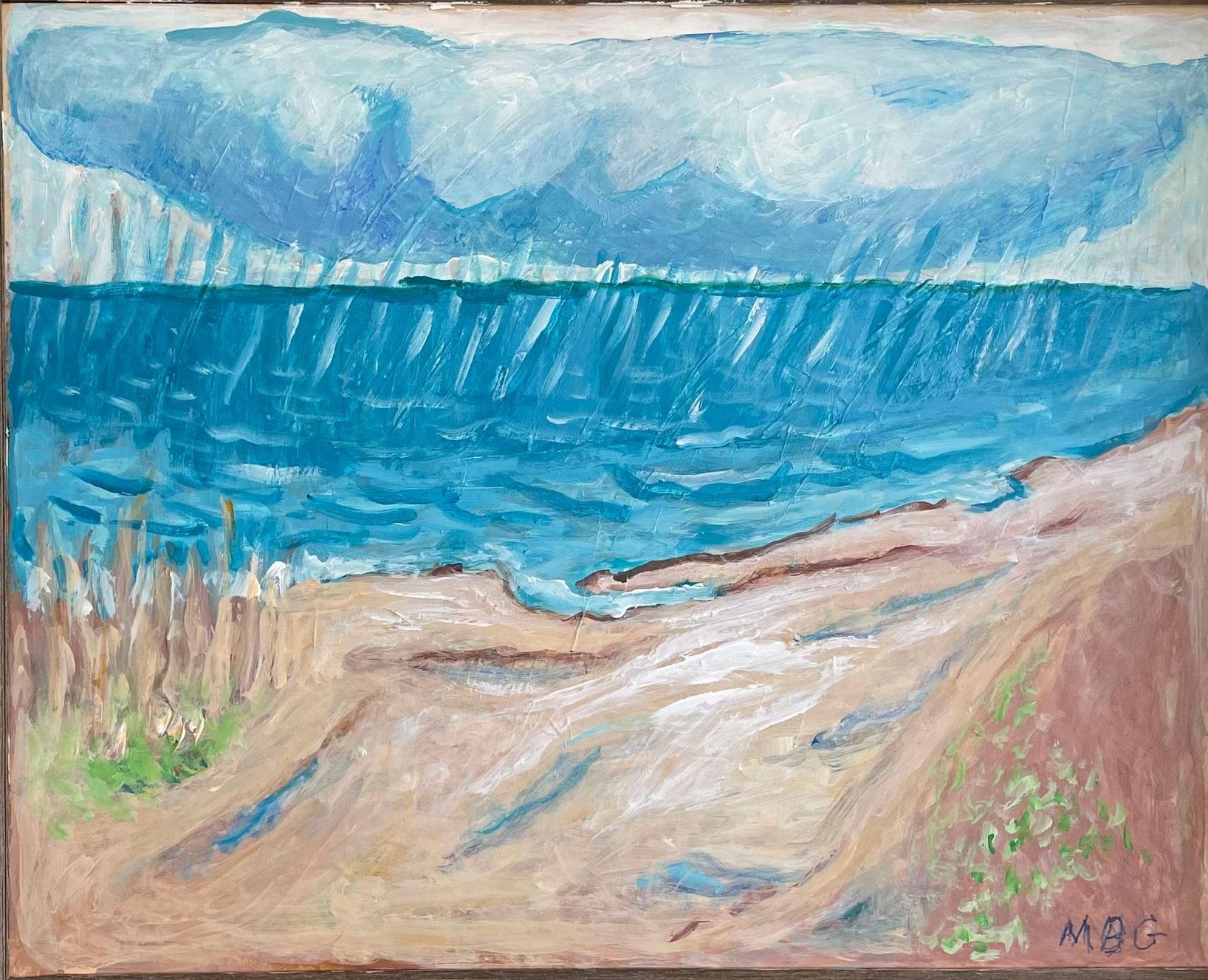 Pastel beach landscape with blue sea, sandy shore, reeds, and distant mountains under cloudy sky