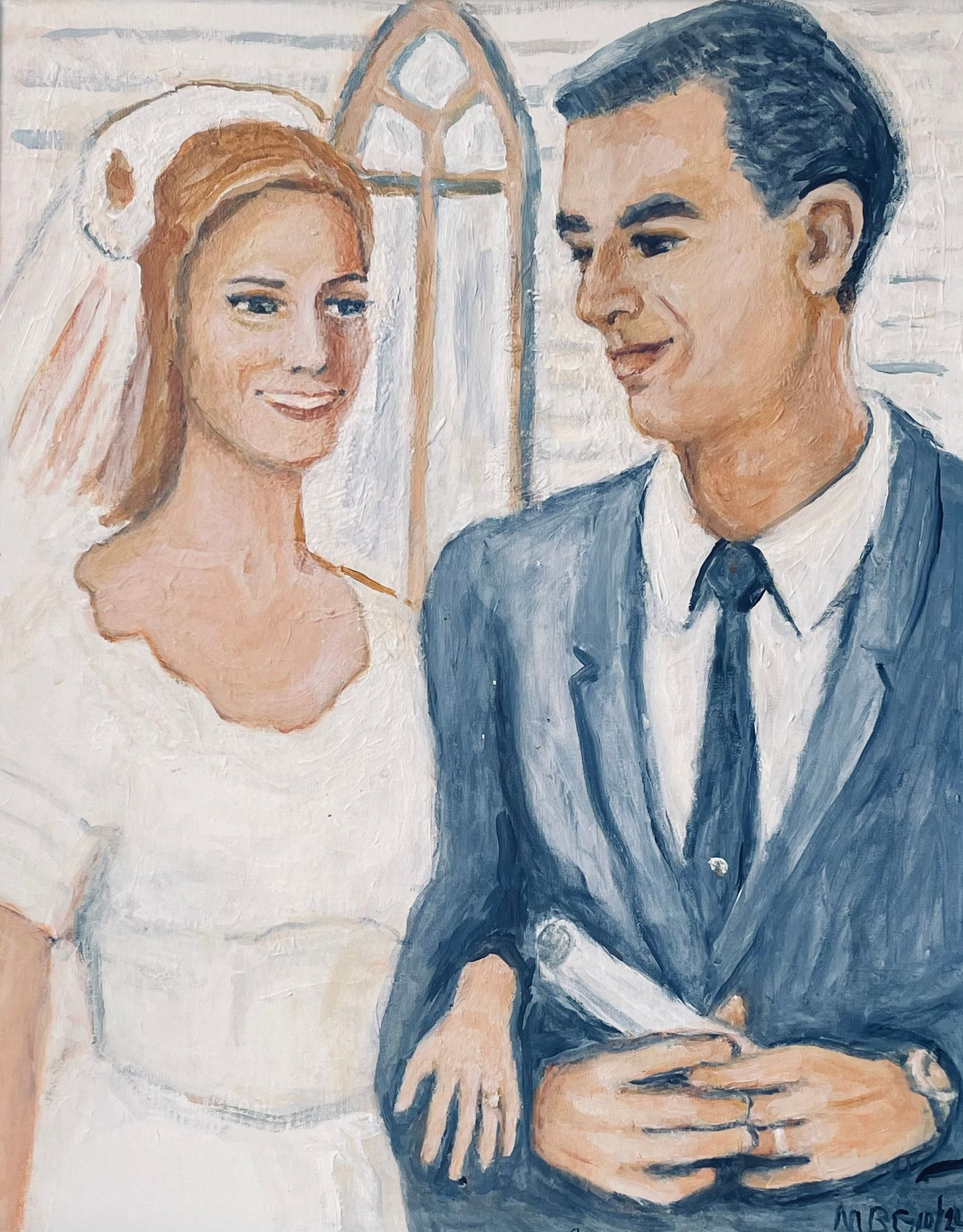 Bride and groom standing together in a church, smiling at each other.
