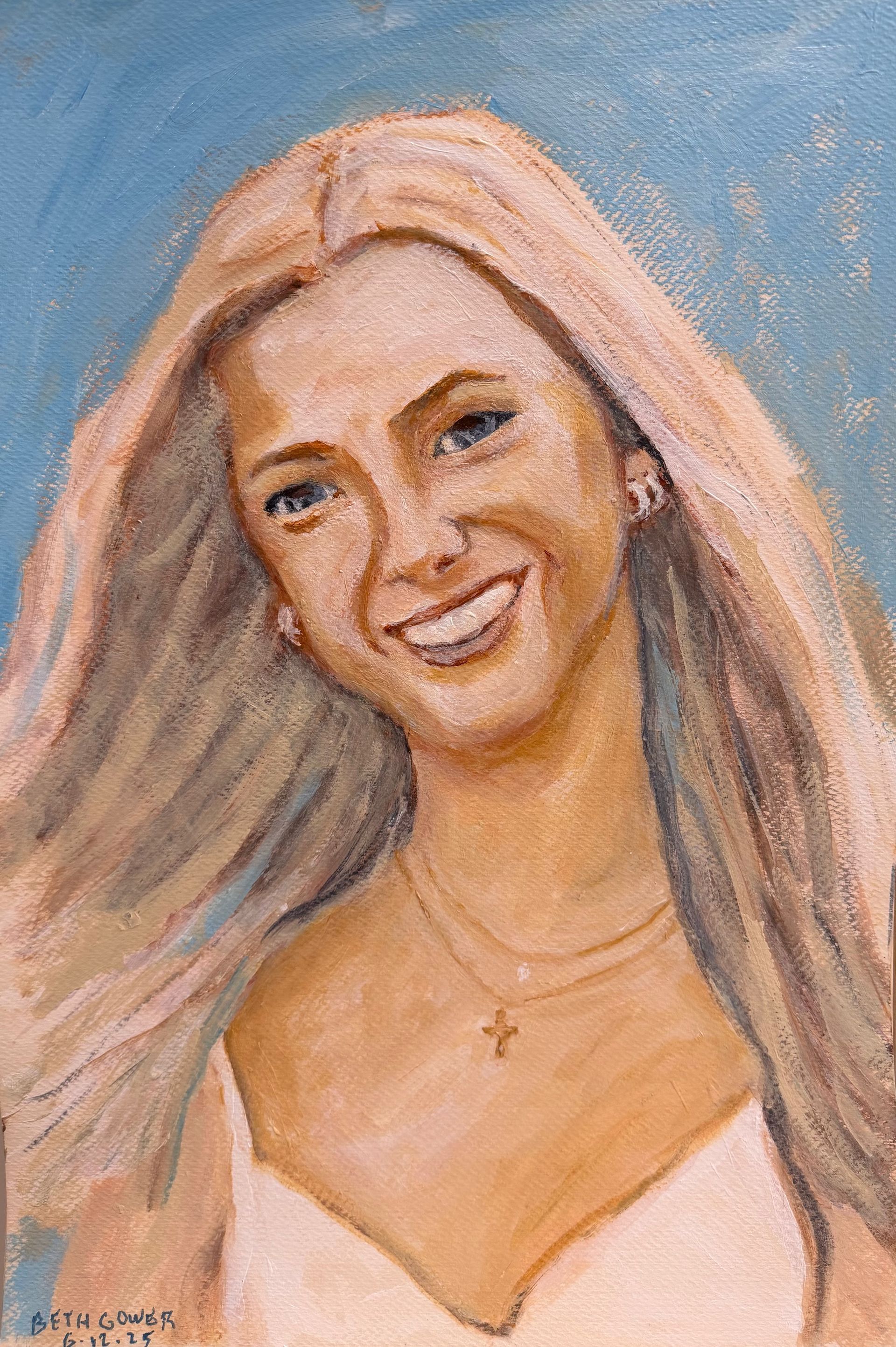 Portrait of a smiling blonde woman against a blue background, wearing a white top and necklace