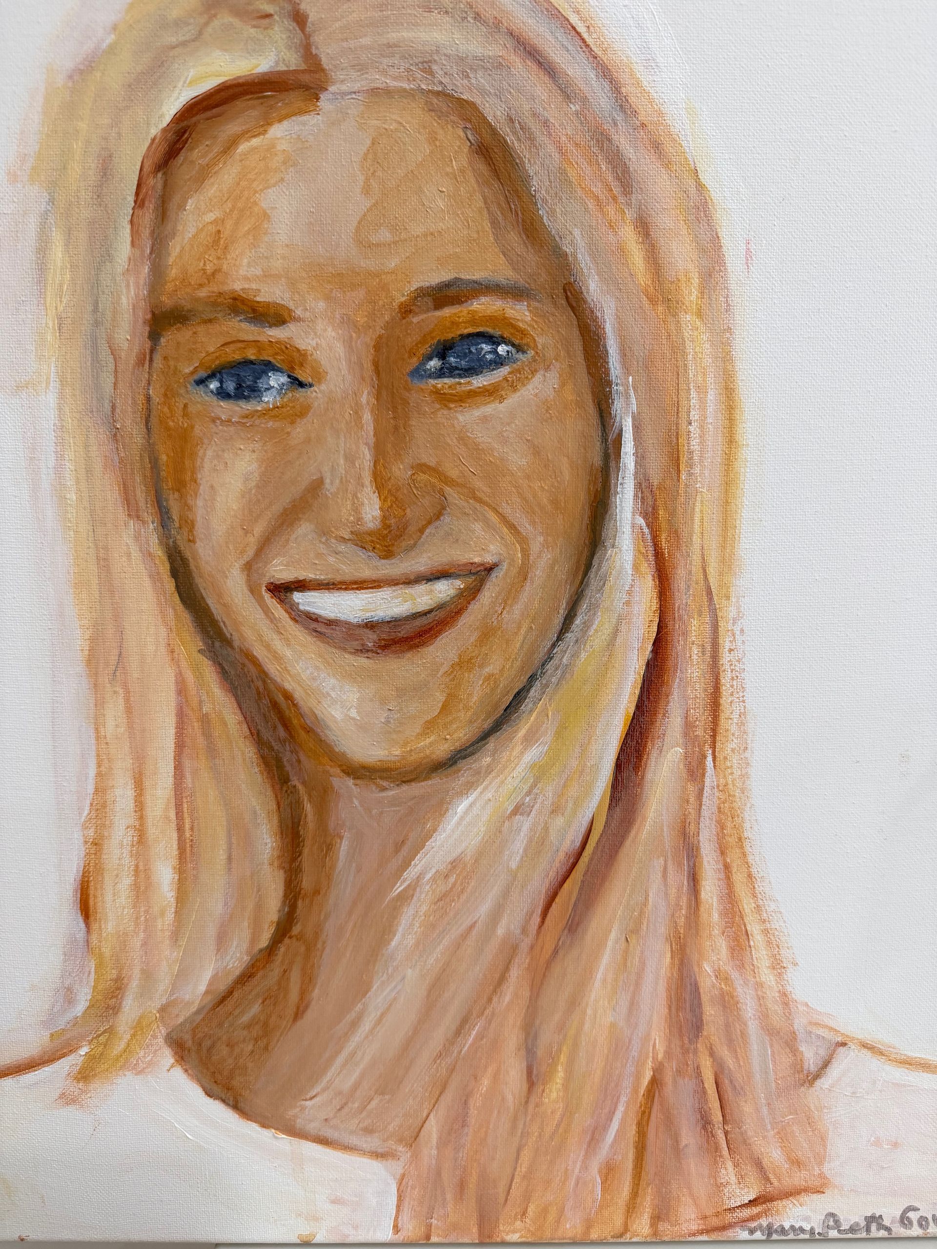 Smiling blonde portrait with blue eyes and soft peach tones on a white background