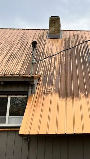 Metal roof before professional soft washing and cleaning, highlighting expert roof cleaning services near Lebanon, TN.
