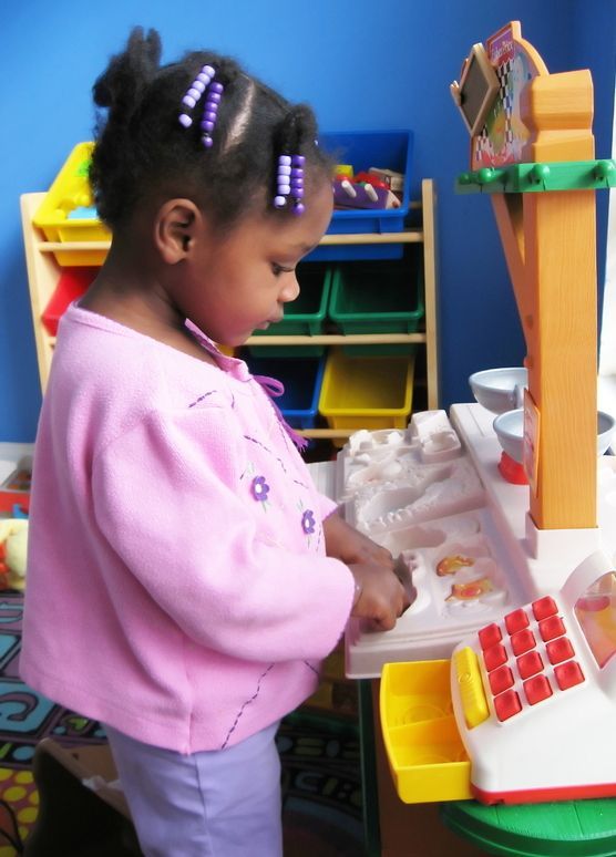 Preschooler playing in classroom