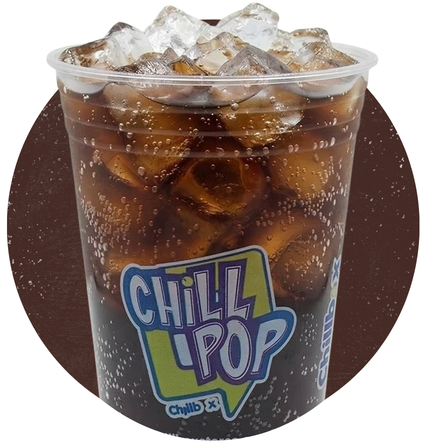 Iced brown drink in a clear cup with a “Chill Pop” logo on a dark background.