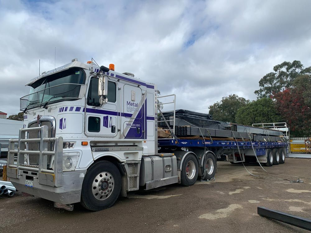 A Truck With Steel Pipes