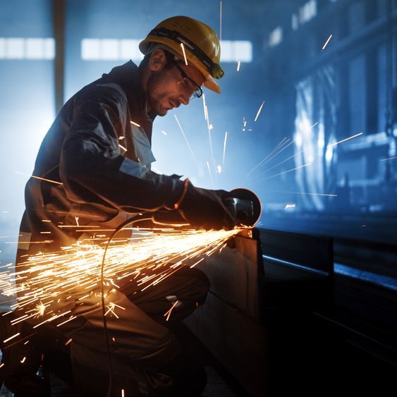Worker Cutting a Metal Tube — Metal Mates in Wyong, NSW