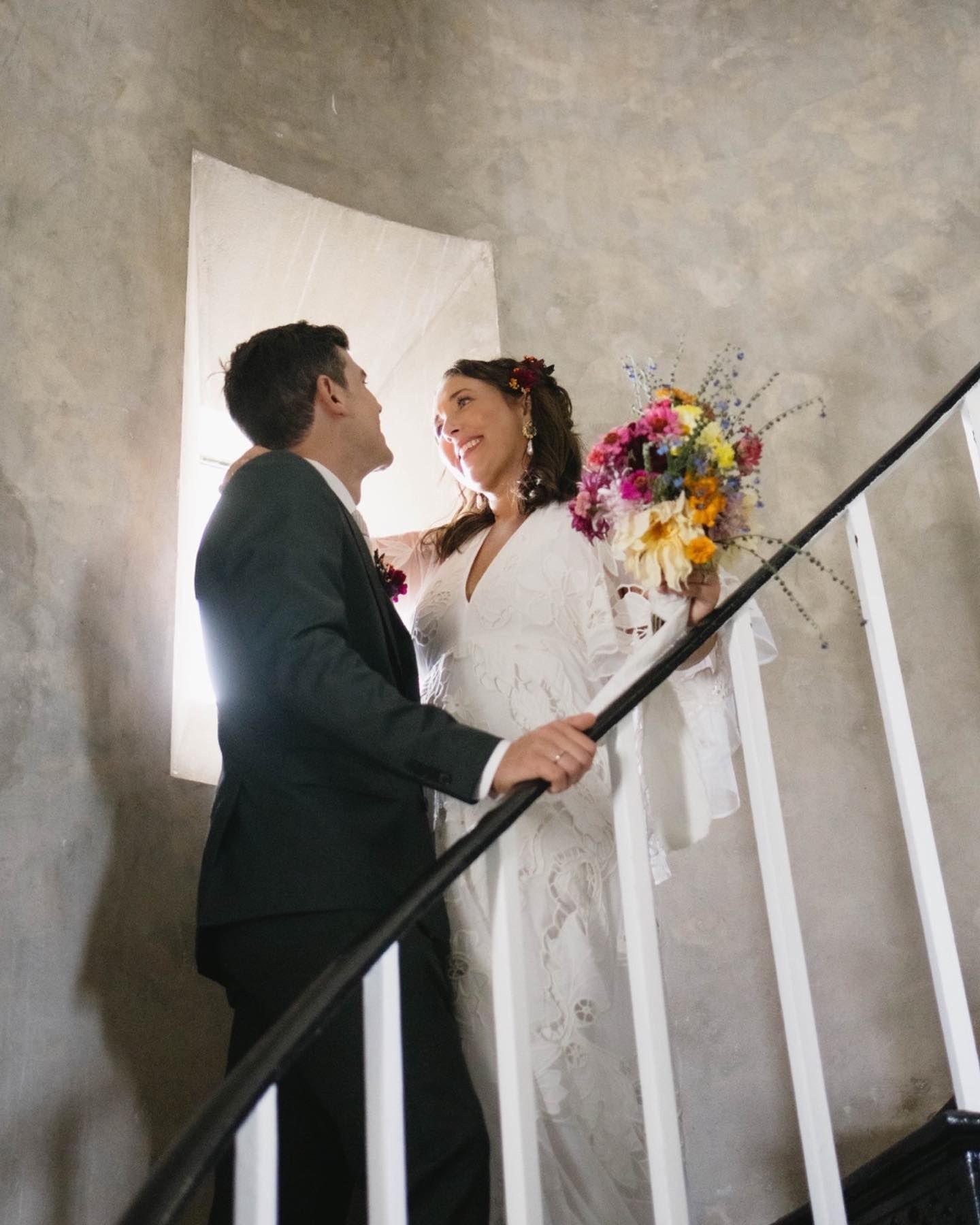 A Bride and Groom Are in a Stairwell Looking Into Each Others Eyes — Seed + Salt Photography In Smithtown, NSW