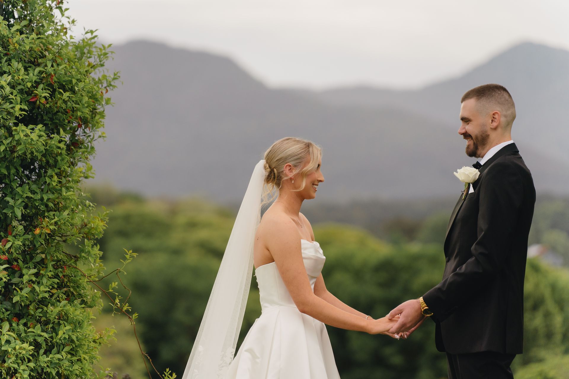 A Bride and Groom Are Posing for A Picture with Their Bridesmaids Lying — Seed + Salt Photography In Smithtown, NSW
